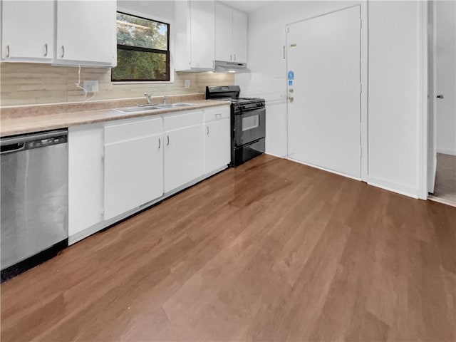 kitchen featuring stainless steel dishwasher, white cabinetry, sink, and black range with gas stovetop