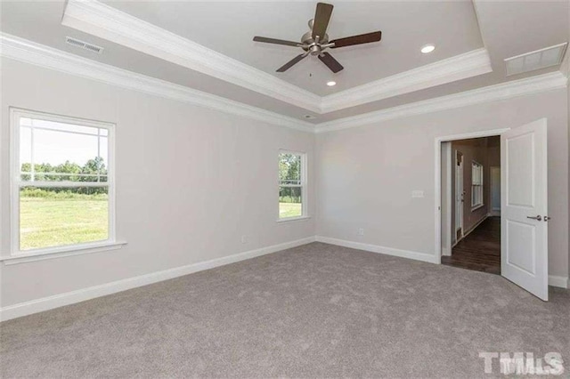 251 Eason St, Bowdon, GA 30108 - carpeted empty room with a tray ceiling, crown molding, ceiling fan, baseboards, and recessed lighting