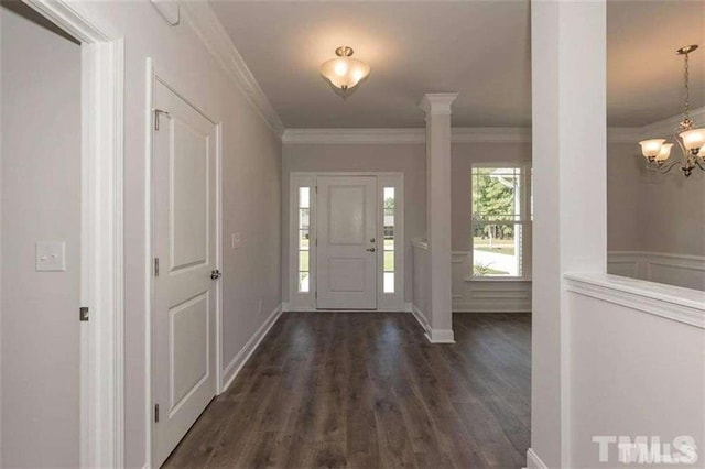 251 Eason St, Bowdon, GA 30108 - entryway featuring dark wood finished floors, ornamental molding, a chandelier, and baseboards