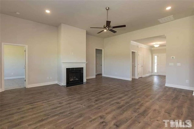 251 Eason St, Bowdon, GA 30108 - unfurnished living room featuring baseboards, a ceiling fan, dark wood finished floors, a fireplace, and recessed lighting