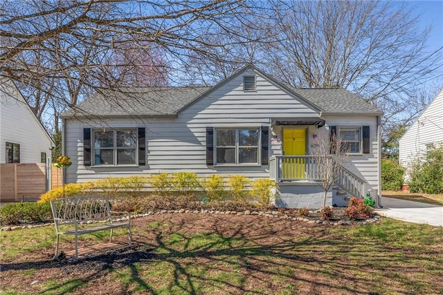 bungalow with a shingled roof