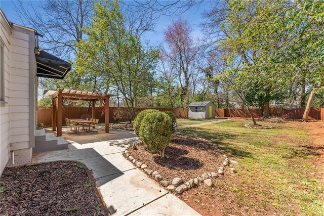 view of yard with an outbuilding, a fenced backyard, a pergola, a shed, and a patio area