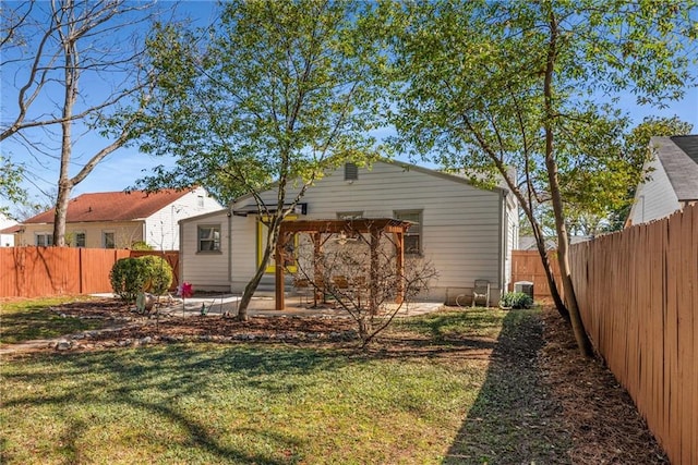 back of house with a yard, central AC unit, a patio area, and a fenced backyard