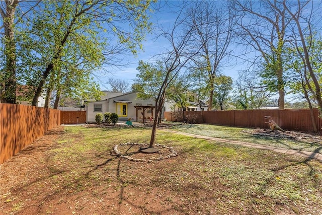 view of yard with a fenced backyard