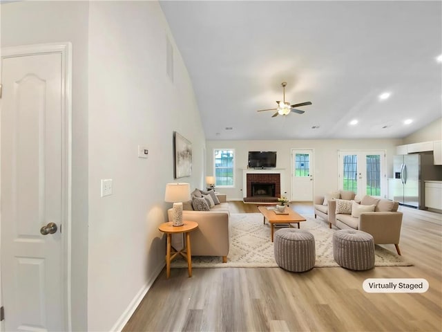 1792 Portwest Way, Hampton, GA 30228 - living area with vaulted ceiling, wood finished floors, ceiling fan, healthy amount of natural light, and recessed lighting