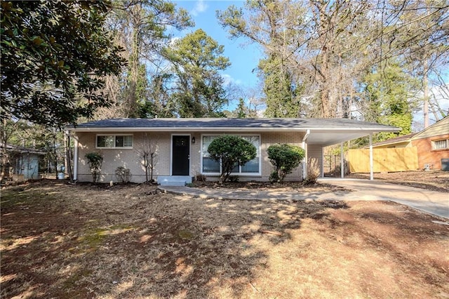 ranch-style house with a carport