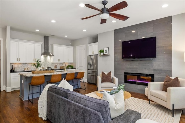 1202 Hardee St NE, Atlanta, GA 30307 - living room featuring a ceiling fan, recessed lighting, dark wood-style floors, and a tiled fireplace
