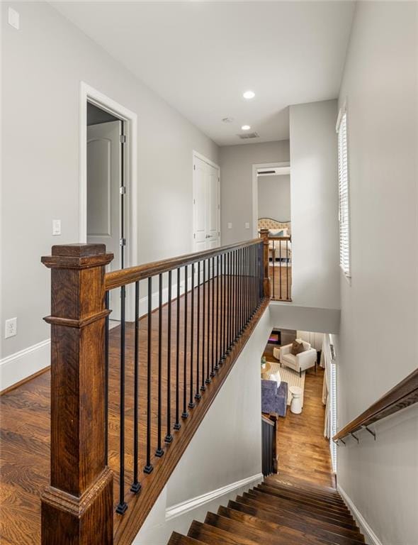 1202 Hardee St NE, Atlanta, GA 30307 - staircase with baseboards, wood finished floors, and recessed lighting