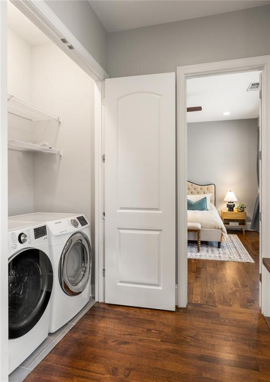 1202 Hardee St NE, Atlanta, GA 30307 - laundry room with washing machine and dryer and wood finished floors