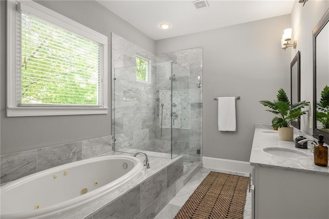 1202 Hardee St NE, Atlanta, GA 30307 - bathroom featuring a jetted tub, double vanity, a shower stall, and baseboards