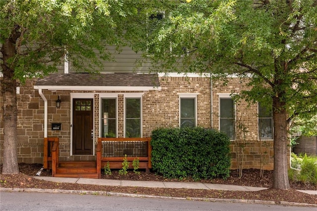 1202 Hardee St NE, Atlanta, GA 30307 - view of front of home with brick siding and a shingled roof