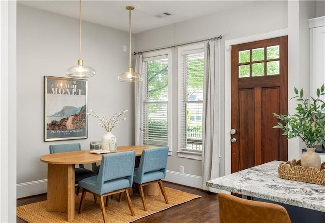 1202 Hardee St NE, Atlanta, GA 30307 - dining space with dark wood-style floors and baseboards