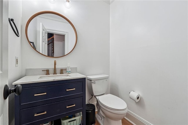 bathroom featuring toilet and vanity
