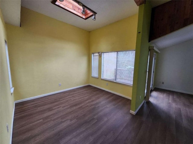 empty room featuring dark hardwood / wood-style flooring