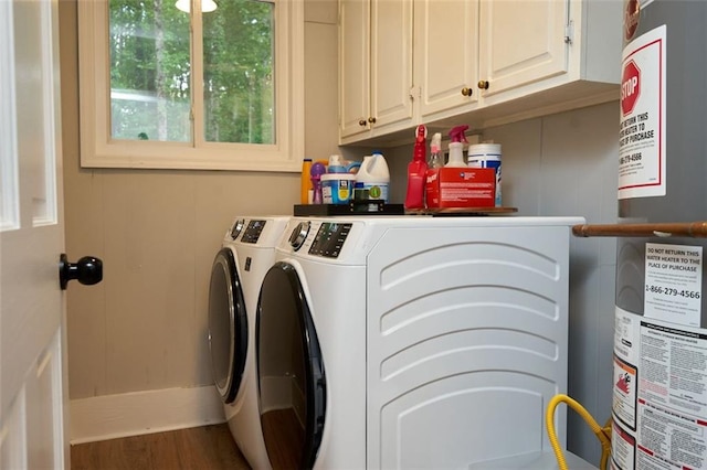 5419 S Lake Dr, Douglasville, GA 30135 - laundry area featuring washing machine and clothes dryer, cabinet space, water heater, and wood finished floors