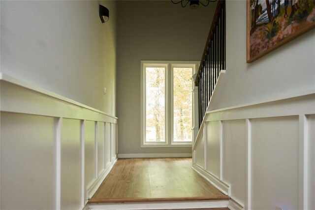 5419 S Lake Dr, Douglasville, GA 30135 - living room featuring a decorative wall, a stone fireplace, and wood finished floors