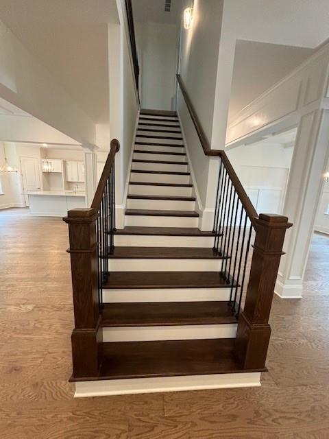 stairway with wood-type flooring