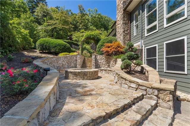 view of patio with an outdoor fire pit