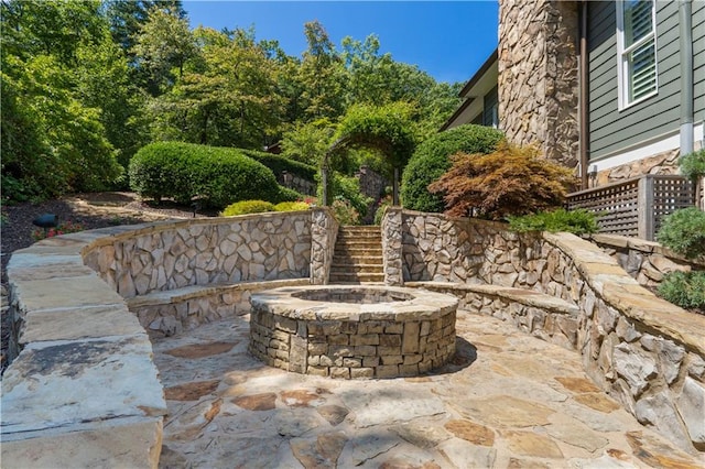 view of patio / terrace with a fire pit