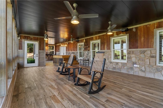 exterior space with wood ceiling and ceiling fan