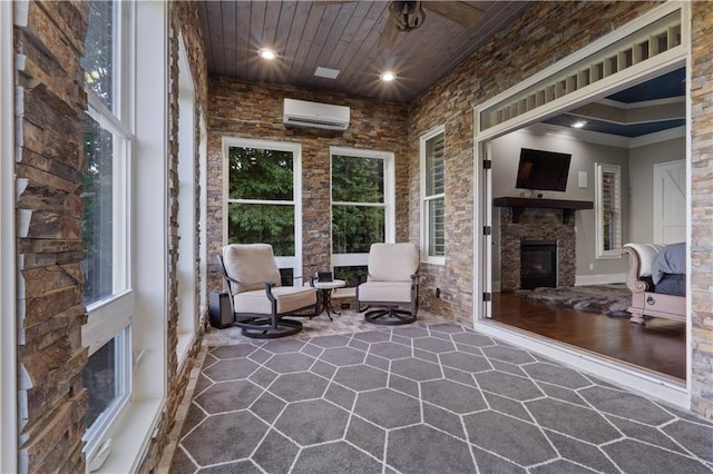 view of patio with ceiling fan and a wall unit AC