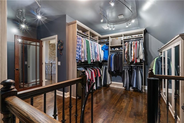 walk in closet featuring dark hardwood / wood-style floors