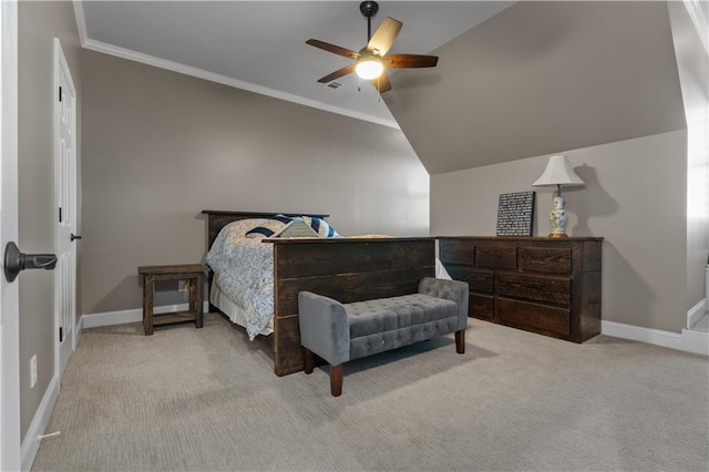 carpeted bedroom featuring ornamental molding, vaulted ceiling, and ceiling fan