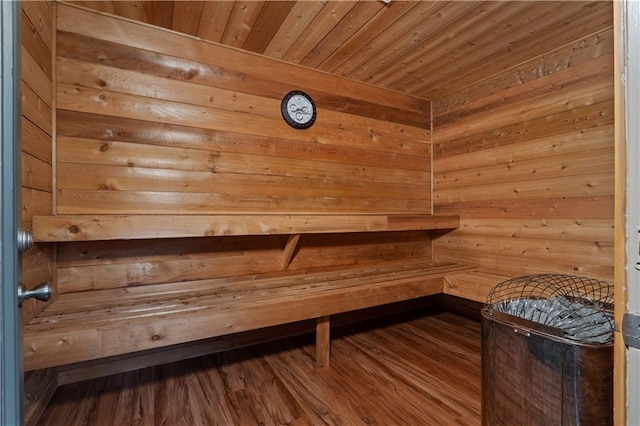 view of sauna / steam room featuring hardwood / wood-style floors, wood ceiling, and wood walls