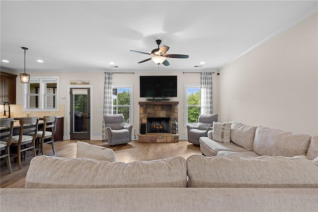 415 Stoneledge Rd, Jasper, GA 30143 - living room with healthy amount of natural light, a ceiling fan, light wood finished floors, recessed lighting, and a stone fireplace