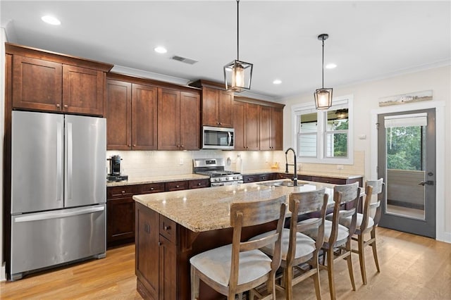 415 Stoneledge Rd, Jasper, GA 30143 - kitchen featuring appliances with stainless steel finishes, light wood-type flooring, tasteful backsplash, light stone countertops, and recessed lighting