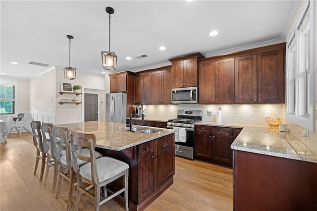 415 Stoneledge Rd, Jasper, GA 30143 - kitchen with stainless steel appliances, light wood finished floors, light stone countertops, recessed lighting, and crown molding