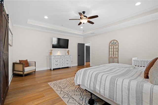 415 Stoneledge Rd, Jasper, GA 30143 - bedroom featuring a tray ceiling, wood finished floors, recessed lighting, ornamental molding, and a barn door