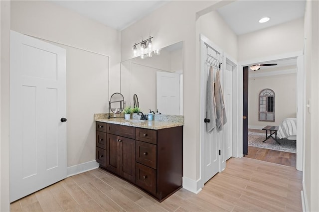 415 Stoneledge Rd, Jasper, GA 30143 - bathroom featuring vanity, wood finished floors, ensuite bath, and ceiling fan