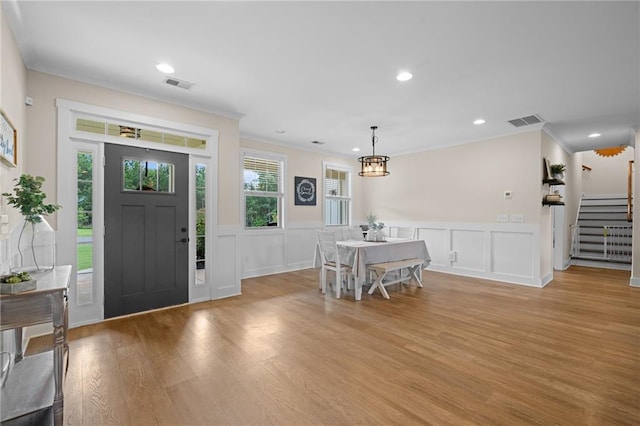 415 Stoneledge Rd, Jasper, GA 30143 - foyer with crown molding, a decorative wall, stairway, light wood-style flooring, and a wainscoted wall