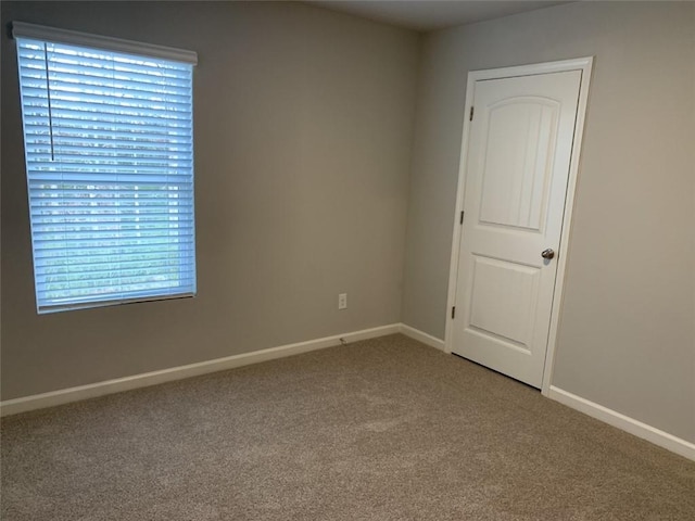 empty room with carpet flooring