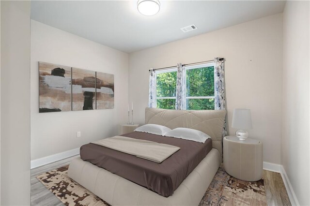 bedroom with light wood-type flooring