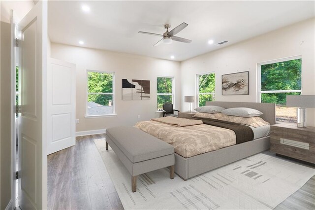 bedroom featuring ceiling fan and light hardwood / wood-style flooring