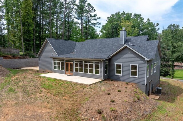 rear view of property featuring central AC and a patio