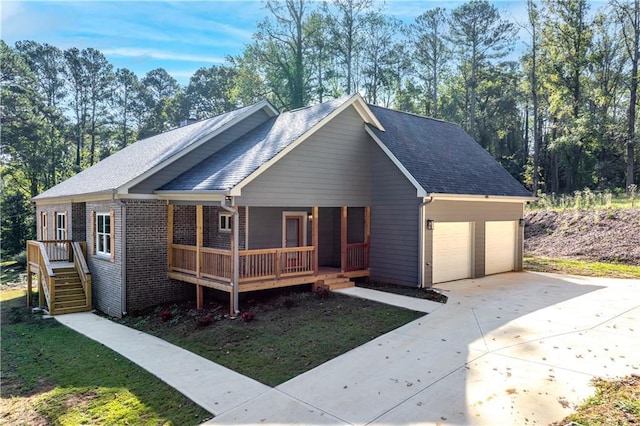 view of front facade with a garage and covered porch