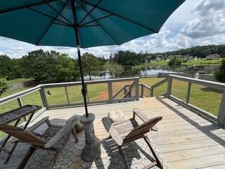 337 Long Shore Way, Newnan, GA 30265 - wooden terrace featuring a water view and a yard