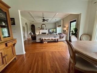 337 Long Shore Way, Newnan, GA 30265 - bedroom featuring wood finished floors, arched walkways, and a fireplace