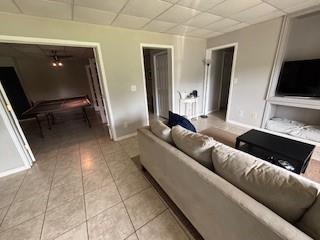 337 Long Shore Way, Newnan, GA 30265 - living area featuring a drop ceiling and light tile patterned flooring