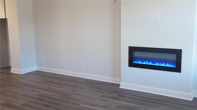 559 Fundao Ln Unit 21, Lawrenceville, GA 30046 - unfurnished living room with dark hardwood / wood-style floors