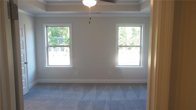 559 Fundao Ln Unit 21, Lawrenceville, GA 30046 - carpeted empty room featuring a raised ceiling, crown molding, and ceiling fan
