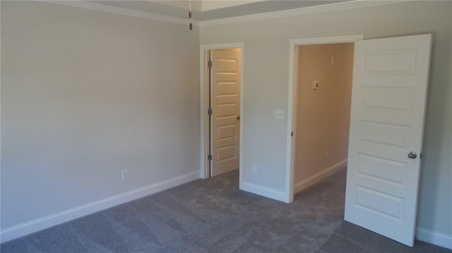 559 Fundao Ln Unit 21, Lawrenceville, GA 30046 - unfurnished bedroom with crown molding and dark carpet