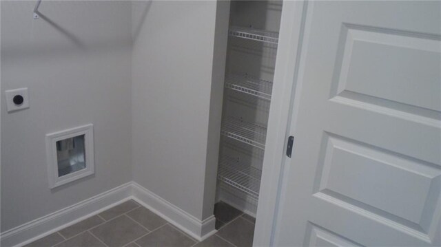 559 Fundao Ln Unit 21, Lawrenceville, GA 30046 - clothes washing area with tile patterned floors and electric dryer hookup