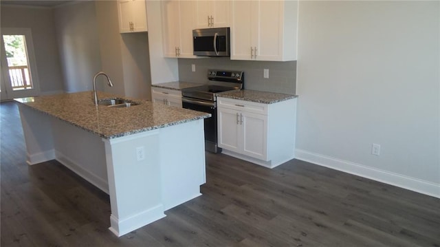 559 Fundao Ln Unit 21, Lawrenceville, GA 30046 - kitchen featuring stainless steel appliances, white cabinetry, a kitchen island with sink, and light stone counters