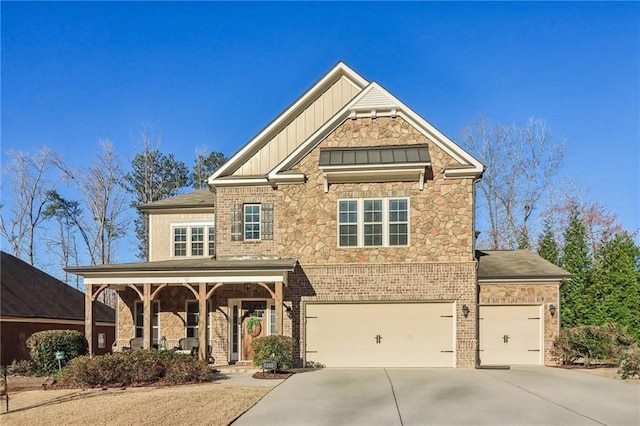 5365 Vendelay Ln, Cumming, GA 30040 - view of front of property with stone siding, board and batten siding, concrete driveway, and a garage