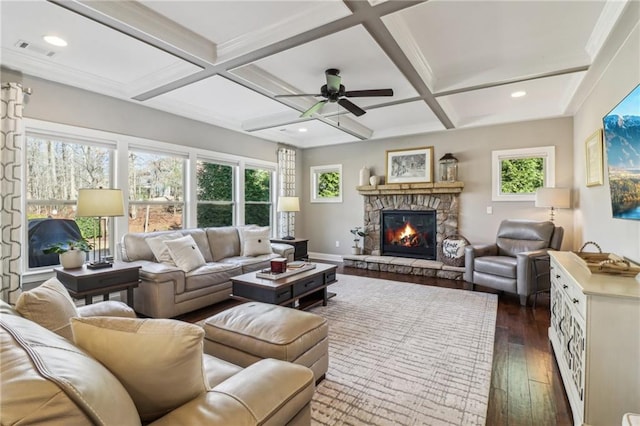 5365 Vendelay Ln, Cumming, GA 30040 - living area featuring a stone fireplace, dark wood-type flooring, coffered ceiling, beam ceiling, and a ceiling fan