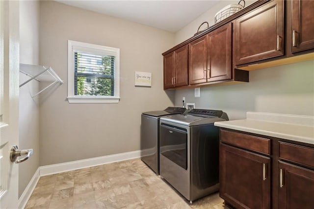 5365 Vendelay Ln, Cumming, GA 30040 - laundry area with cabinet space, washing machine and dryer, and baseboards